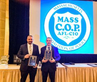 Officers Kane and Hall receive the Mass C.O.P. Presidents award