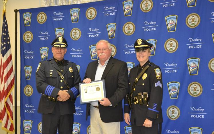 Thomas Meehan receiving his graduation certificate