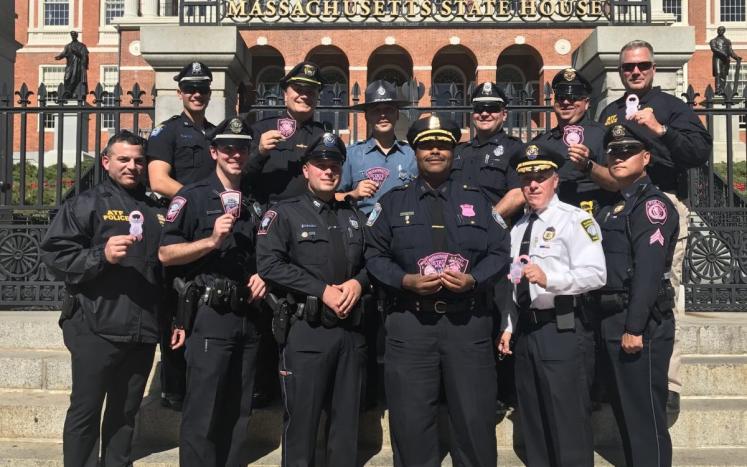 Officer Ryan Peterson at the MA State House in Boston with other MA Pink Patch Project partner agencies